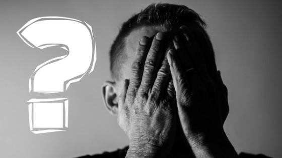 man covering face